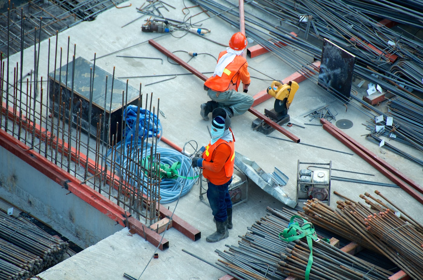 Workers handling materials at a construction