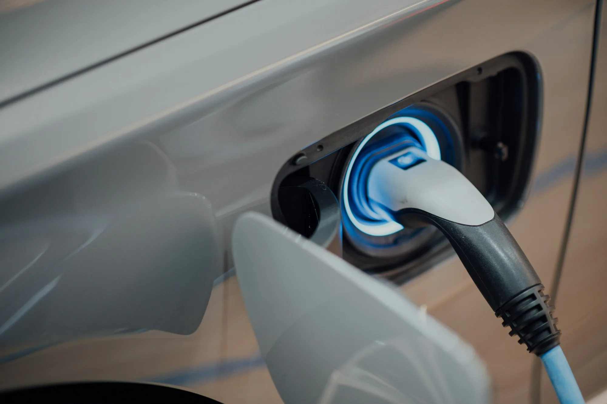 Electric vehicle connected to a charging cable