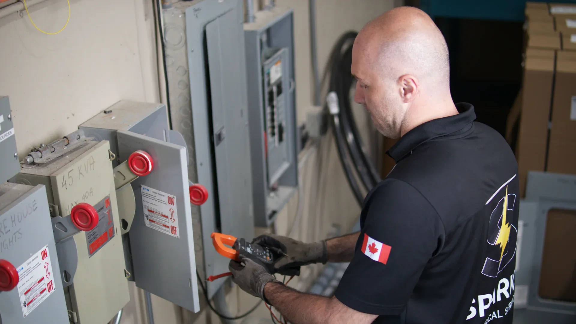 Electrician testing a commercial breaker panel